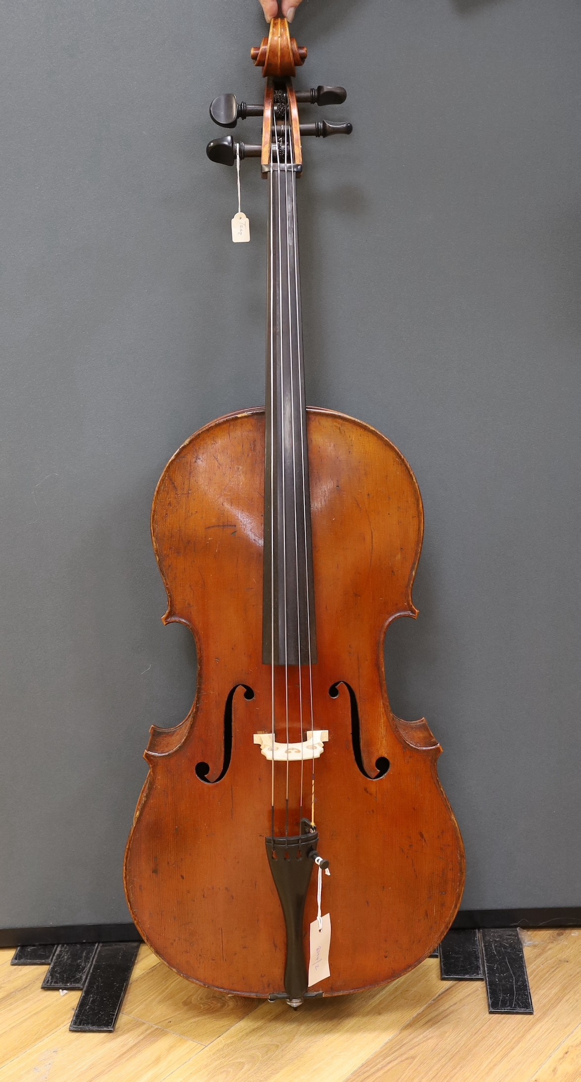An early 20th century French half size cello, with soft case and bow